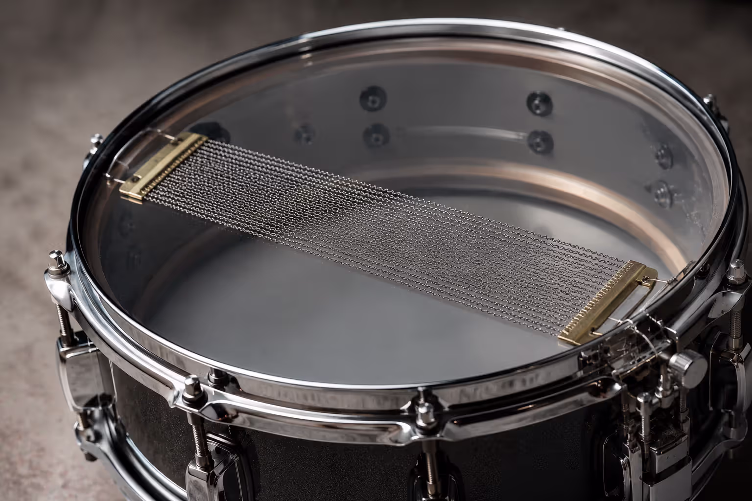 Snare drum with visible snare wires underneath